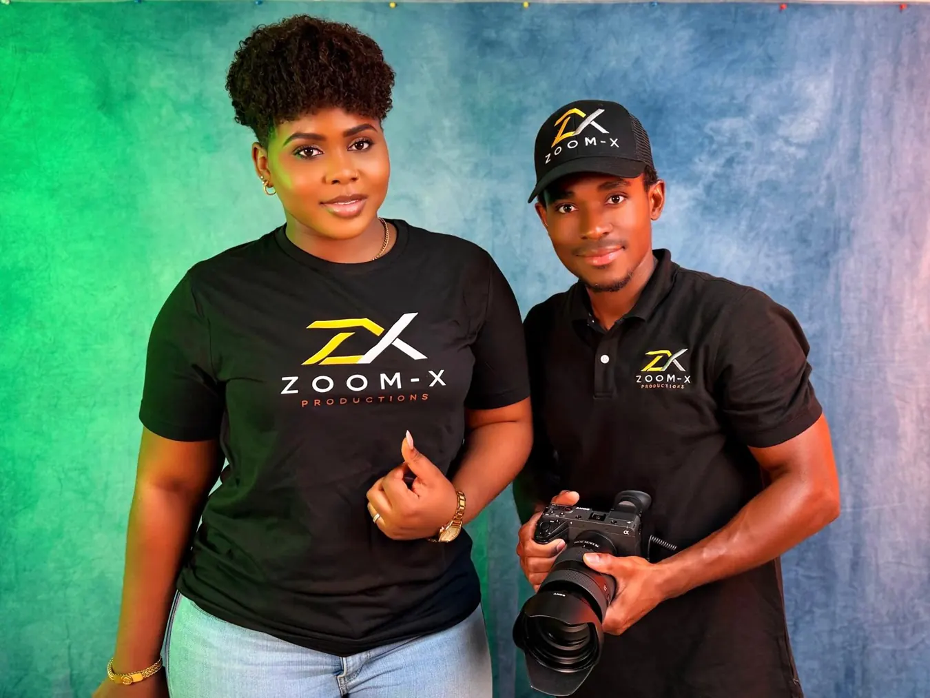 Zoom-X Productions staff wearing branded clothing and holding a camera
